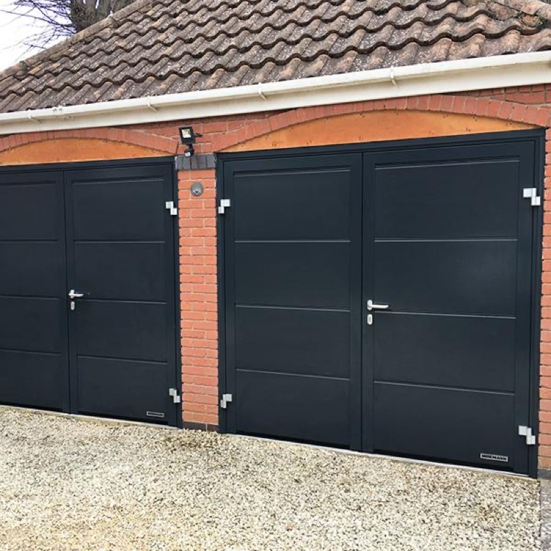 Pair of side-hinged garage doors with a matching pedestrian door